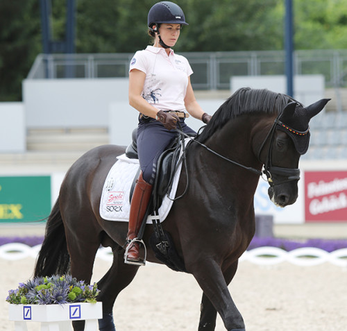 Kristina Sprehe and Desperados FRH enjoying schooling in a snaffle © Ilse Schwarz/dressage-news.com